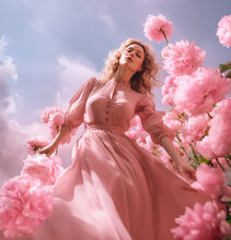 Woman Happy In Flowers Field, Fashion And Beauty Model. Young Woman In Pink Dress In Joy In High Grass Flowers With Sky Above By AI Generative