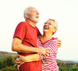 © Lumos sp - woman man outdoor senior couple happy lifestyle retirement together smiling love hug nature mature