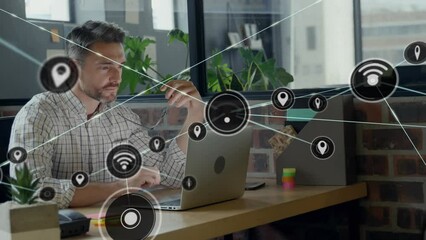 Poster - Animation of network of digital icons against caucasian man using laptop at office