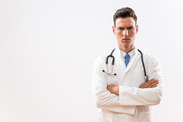 Wall Mural - Portrait of young angry doctor thinking.	