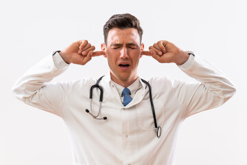 Wall Mural - Image of overworked doctor with hands in ears .	