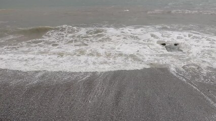 Poster - sea with waves in cloudy weather.
