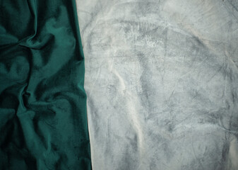 green and gray velvet crumpled background image, green silk fabric for background wallpaper for web design, nice combination of emerald and gray textile background