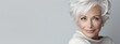 © Patrick - Elegant senior woman with short silver hair and warm smile, mature beauty or aging gracefully concept, confident female portrait showcasing natural gray hairstyle and timeless style