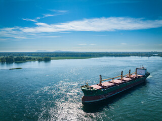 Aerial view of a cargo ship near the Port of Montreal on the St. Lawrence River