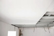 Structure with profiles and plasterboard for installation of suspended ceiling