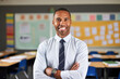 © MVProductions - A portrait of male elementary school teacher in classroom