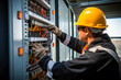 © MVProductions - Male commercial electrician at work on a fuse box, adorned in safety gear, demonstrating professionalism