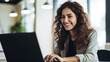 © MP Studio - Young woman working on a laptop.