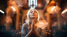 Woman During Prayer In A Church.