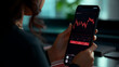 © YM Creative Studio - female hand holding smartphone, business style, stocks and exchanges, professional photo