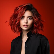 Beautiful Fashion Model With Creative Short  Hairstyle, Studio Shot. Portrait Of Beautiful Young Woman In Black Clothes With Red Hair On Red Background. Portrait Of A Fashion Model With Bright Makeup.