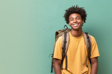 Fictional young black model with a backpack, isolated on a green background. Generative AI.