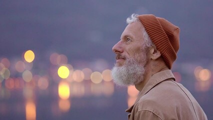 Wall Mural - Happy older man standing in nature park enjoying natural park landscape. Smiling mature active traveler exploring camping tourism nature lake and mountains travel journey feeling freedom.