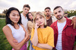 © CarlosBarquero - Taking life very seriously. Group of casually dressed young adults looking serious at the camera outdoors. Focused students unsmiling. They are confident in their field of work.