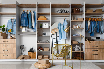 Wall Mural - Stylish clothes with modern shoes and accessories in boutique