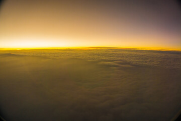 Wall Mural - Morning sunrise sky with cloud above view from airplane