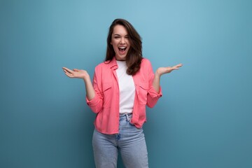 Canvas Print - long haired brunette young woman in casual outfit posing over isolated background