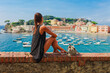 Tourist woman in Sestri Levante, Liguria, Italy. Summer beach, sea