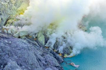 Fuming sulfur mine in Kawah Ijen crater, Indonesia