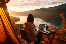 Young Woman Freelancer Traveler Working Online Using Laptop And Enjoying The Beautiful Nature Landscape With Mountain View At Sunrise