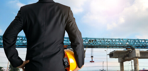  engineer holding a helmet supervisor construction of expressway