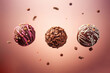 Close up of three selection of decorated chocolate balls flying in the air
