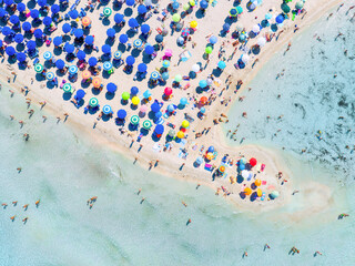 Wall Mural - aerial view on beach, people and umbrellas. vacation and adventure. europe, mediterranean sea. top v
