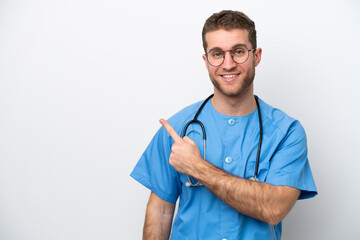 Wall Mural - Young surgeon doctor caucasian man isolated on white background pointing to the side to present a product