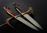 Fototapeta Storczyk - Hunting knife handmade on a black background.
