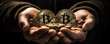Bitcoin gold coins in hands with black background. wide banner
