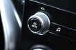 Close up of a new car's volume control