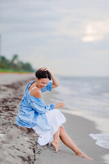 Wall Mural - Happy woman on the beach vacation