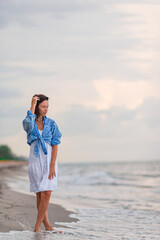 Wall Mural - Happy woman on the beach vacation