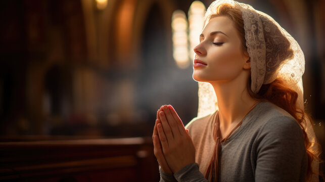 Woman during prayer in a church.