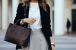 Autumn trendy outfit woman in stylish beige coat with black big bag.