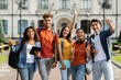 © Prostock-studio - Freshmen Orientation. Group Of First Year Students With Workbooks Posing Together Outdoors