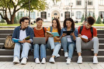 Wall Mural - Group Of University Students Preparing For Classes Together Outdoors