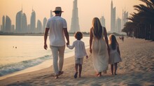 A Family Parents With Their Children Walking On The Beach In The Vacation In Dubai Uae. Enjoying Holiday Together. Skyscrapers Burj Khalifa In The Background. For Tourism Ads And Design. Generative AI