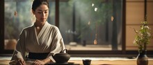 Traditional Japanese Tea Ceremony: Graceful Woman Preparing Tea In Tranquil Zen Setting

