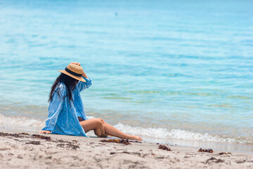 Wall Mural - Happy woman on the beach vacation