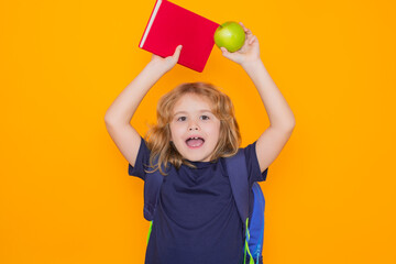 Aufkleber - School children. Child from elementary school with book and apple isolated on yellow background. Little student, clever nerd pupil ready to study. First time to school.