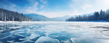 Blue Ice And Cracks On The Surface On Frozen River. Panorama Photo