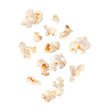 Fluffy popcorn scattered in the air closeup isolated on white background