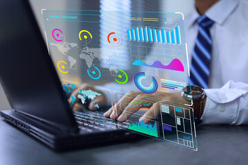 Wall Mural - Businessman analyzing data through laptop virtual screen, data science analytic dashboard to sum up KPI performance or earnings from trading or digital assets. Create reports of business management.