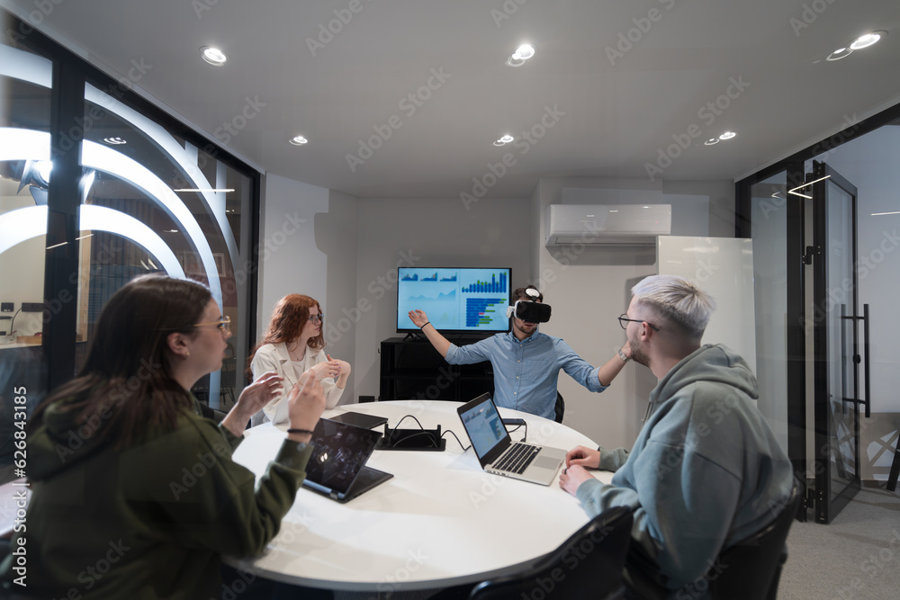 A diverse group of businessmen collaborates and tests a new virtual ...