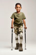© the_lightwriter - black kid with prosthetic legs trying to walk again, rehabilitation