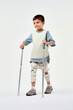 kid with prosthetic legs trying to walk again, rehabilitation