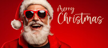 Merry Christmas Holiday Vacation Winter Greeting Card Concept,  - Cool Hipster Santa Claus With Sunglasses, Isolated On Red Background (Generative Ai)