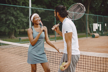 Two tennis players with rackets in hands before the match